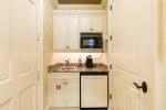 The guest suite boasts a kitchente with granite countertops, fridge, microwave and coffee maker